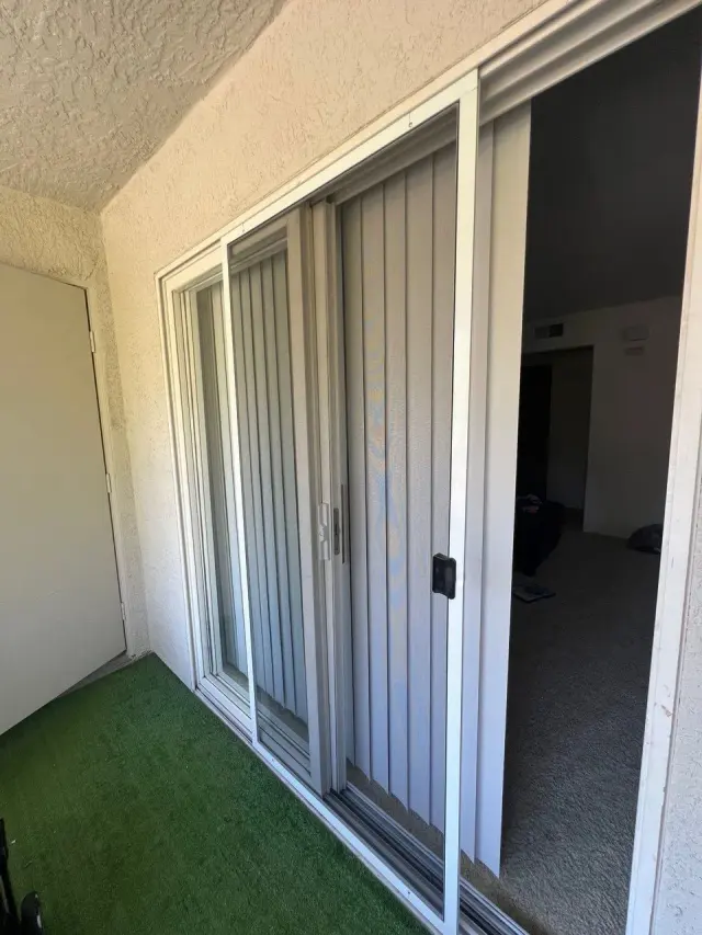 Sliding patio door with a sliding screen door