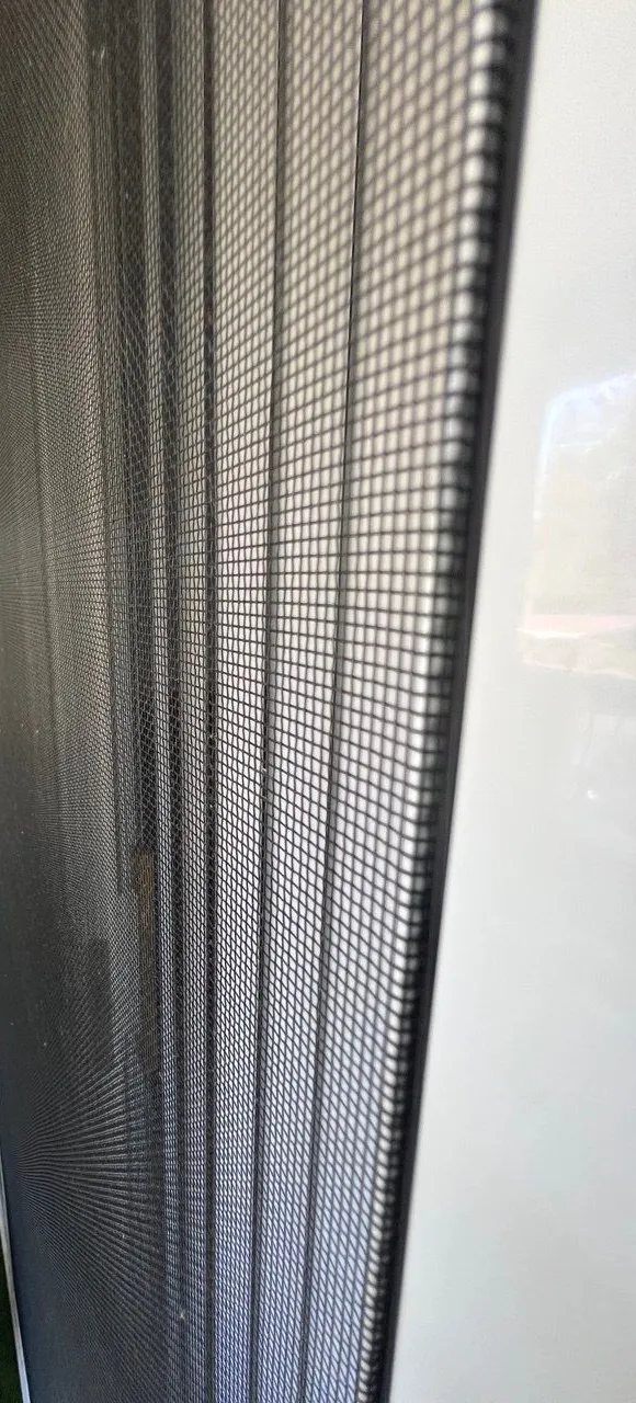 Close-up of the mesh on a sliding screen door