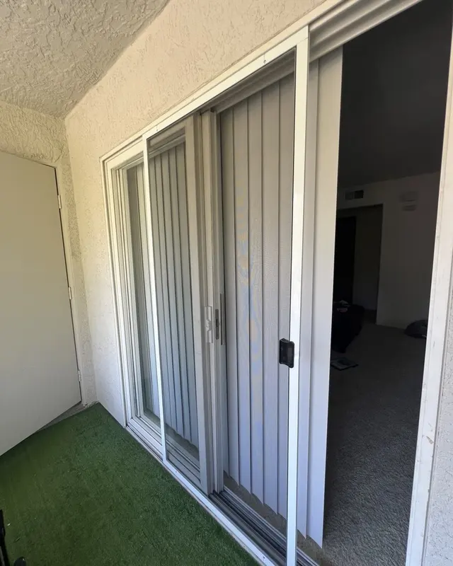 Sliding patio door with a new screen door installed